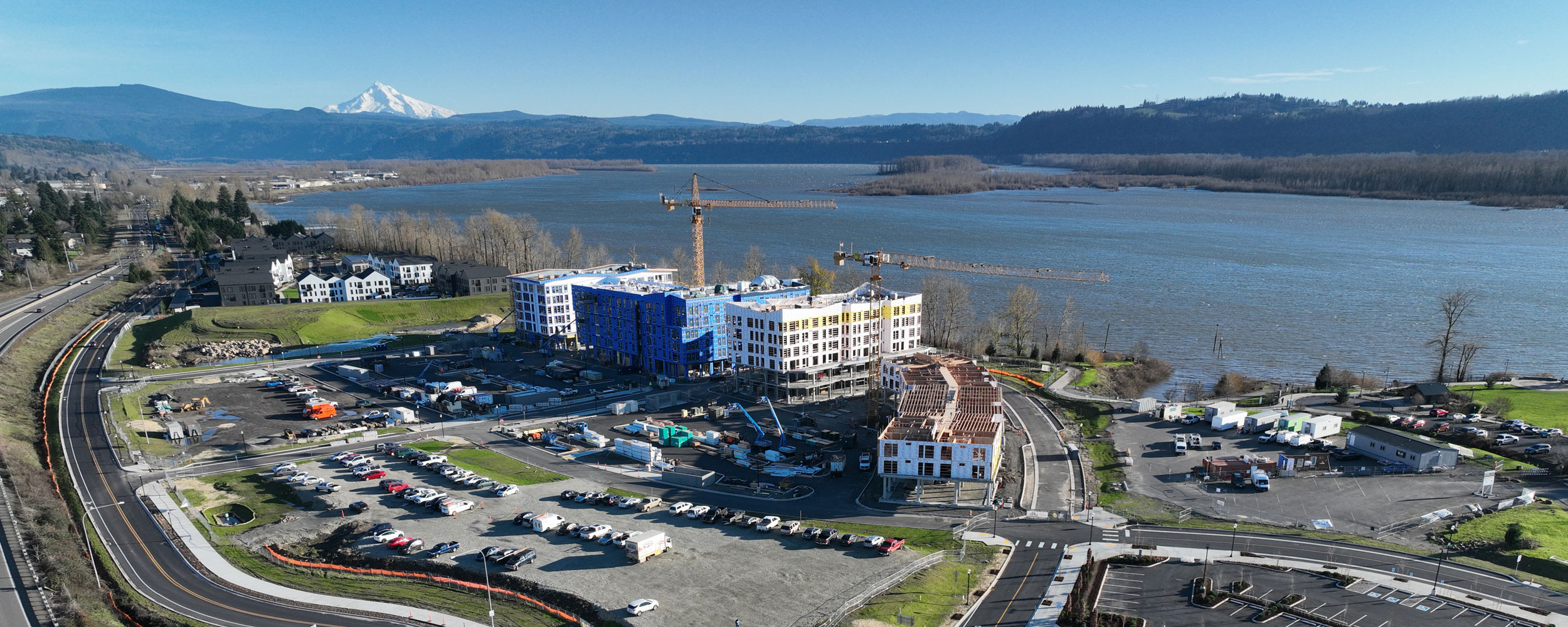 Hyas Point apartments development with crane and river backdrop