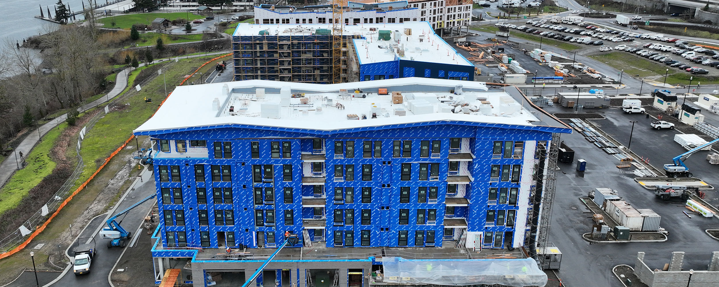 Construction progress at Hyas Point Building A with crane and river views